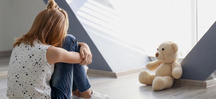 Young girl soothing herself alone